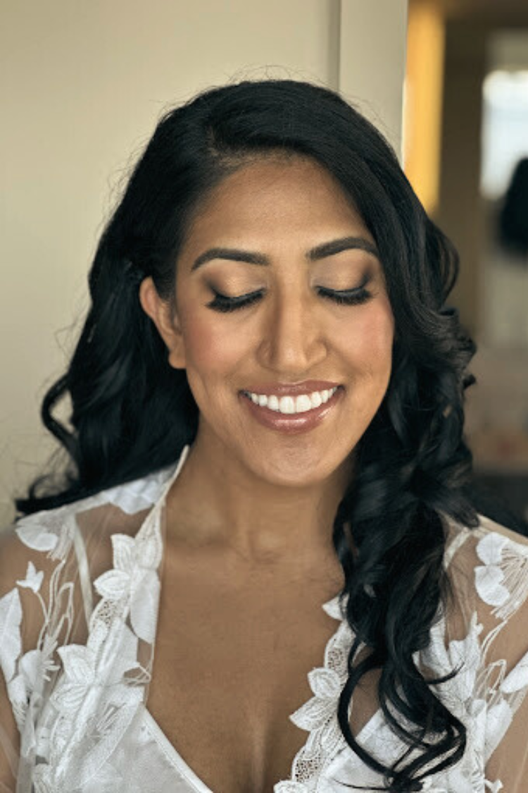 Elegant bride wearing luxury wedding makeup and romantic hairstyling by AD Artistry