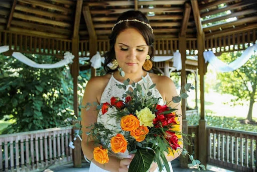 An AD Artistry bride looking down at her flowers